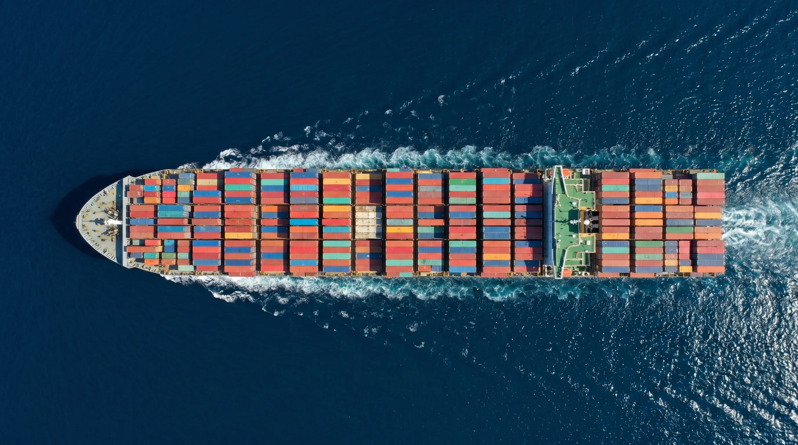 Aerial drone view of a cargo container ship sailing the ocean